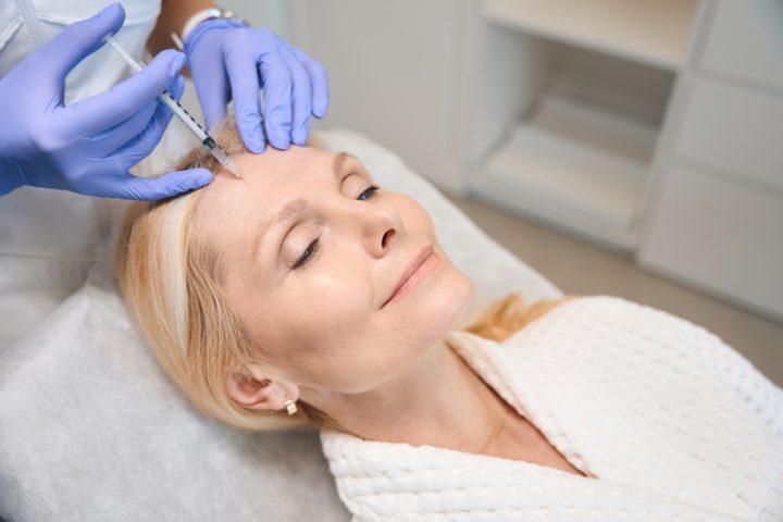 Woman having Botox to smooth wrinkles at Vedas Medical Spa & Wellness Center